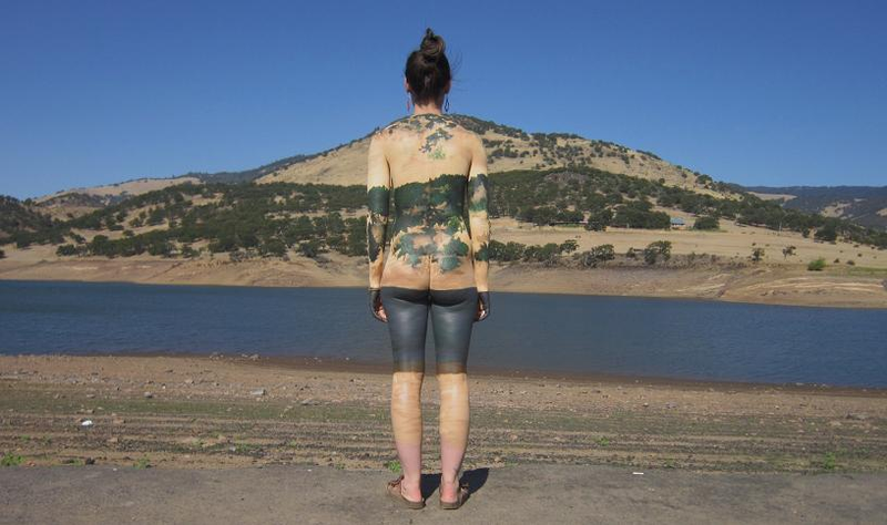 Illustration for article titled People turn invisible in these awesome body paint photographs (NSFW)